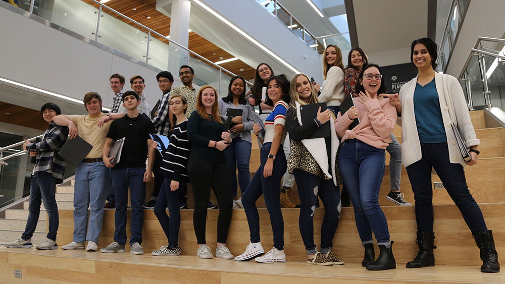 Group posing for camera together.