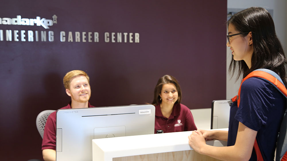 Student at career center front desk.