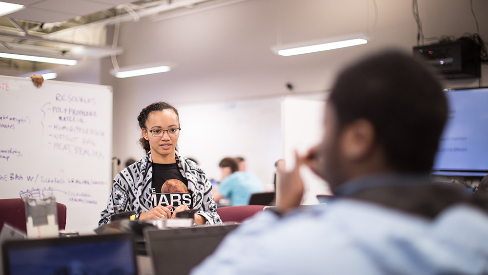 Female engineering students in design center during Aggies Invent