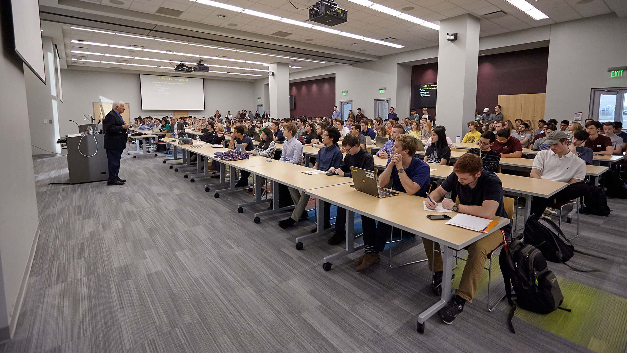 Students seated in Zachry listen to a lecturer