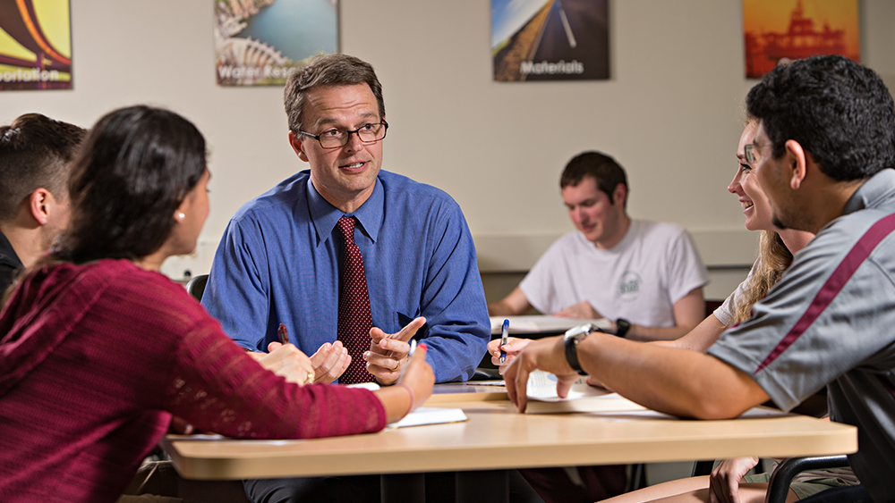 professor talks to students