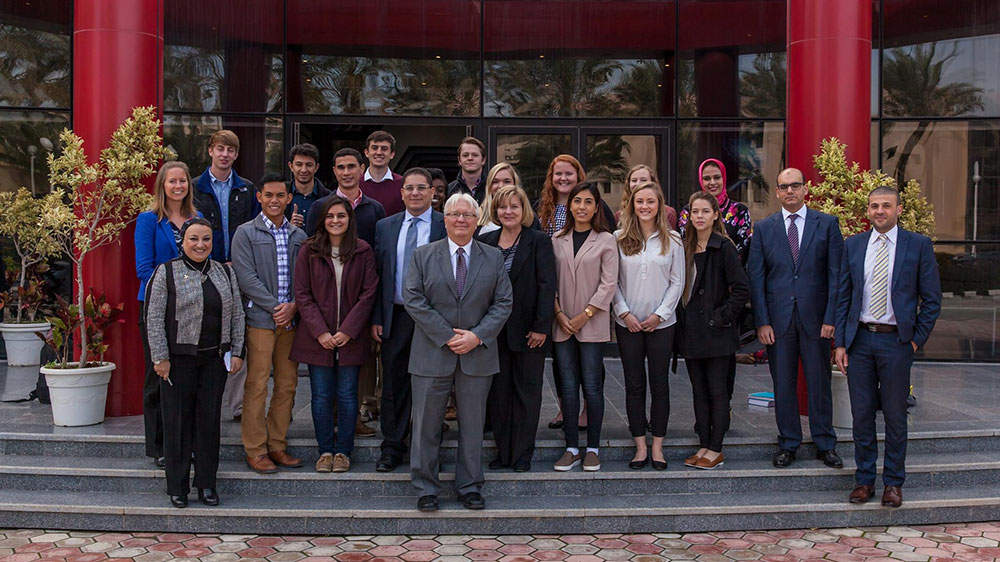 Group of students standing in front of embassy