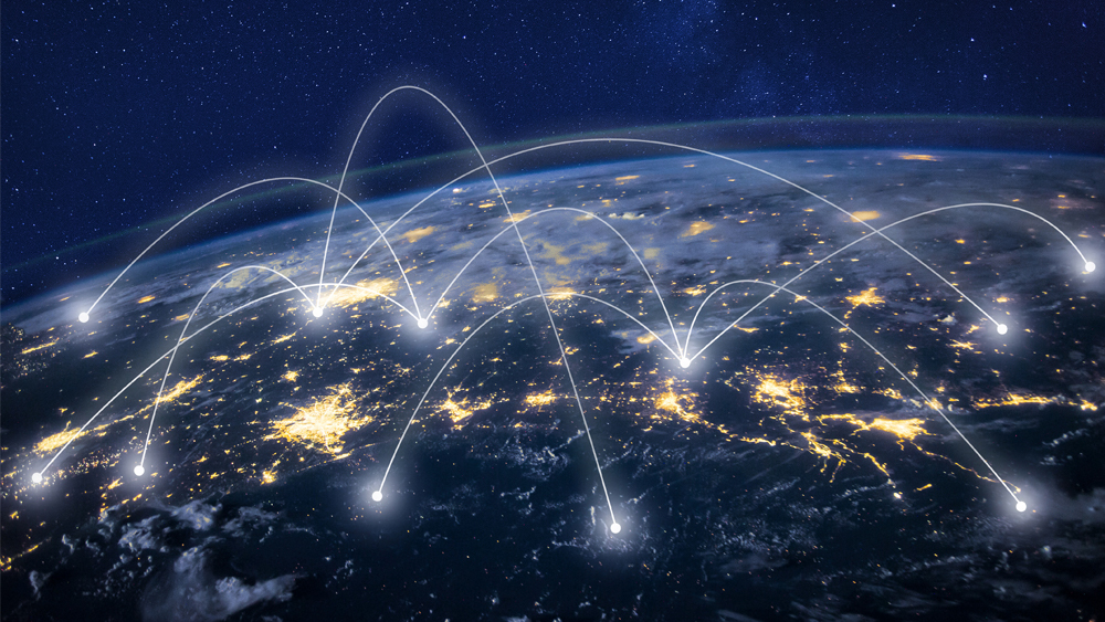 Earth from outer space with graphics of lines representing networks.