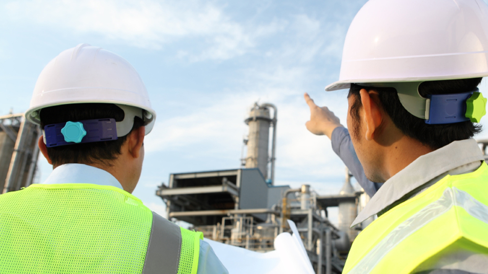 Two men in hardhats on a construction site