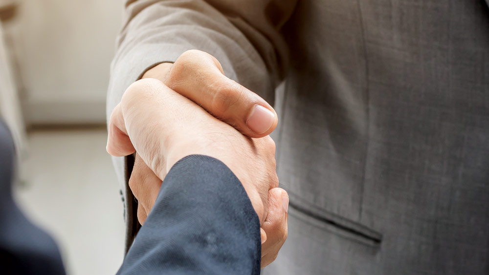 two people shaking hands