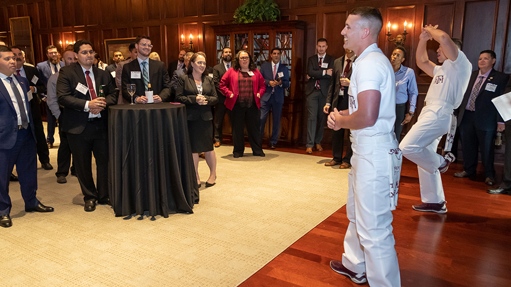 Texas A&amp;M University Yell Leaders leading a yell to METM students during Residency Week.