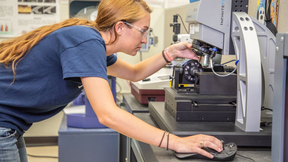 Female MSET student working in a lab