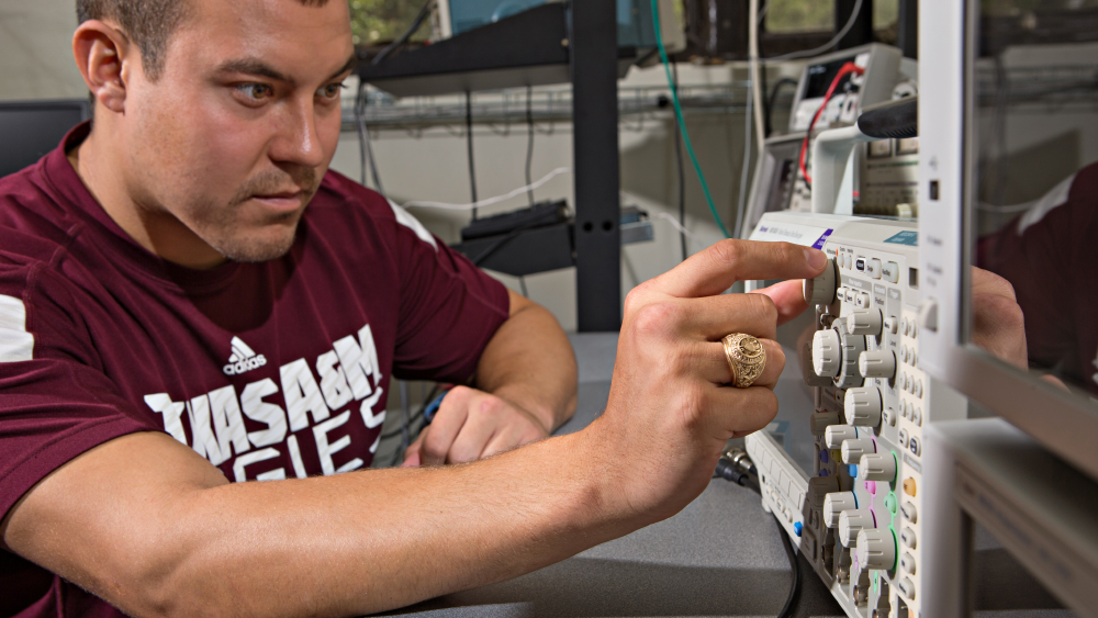 ETID undergraduate student testing an embedded electronic device.