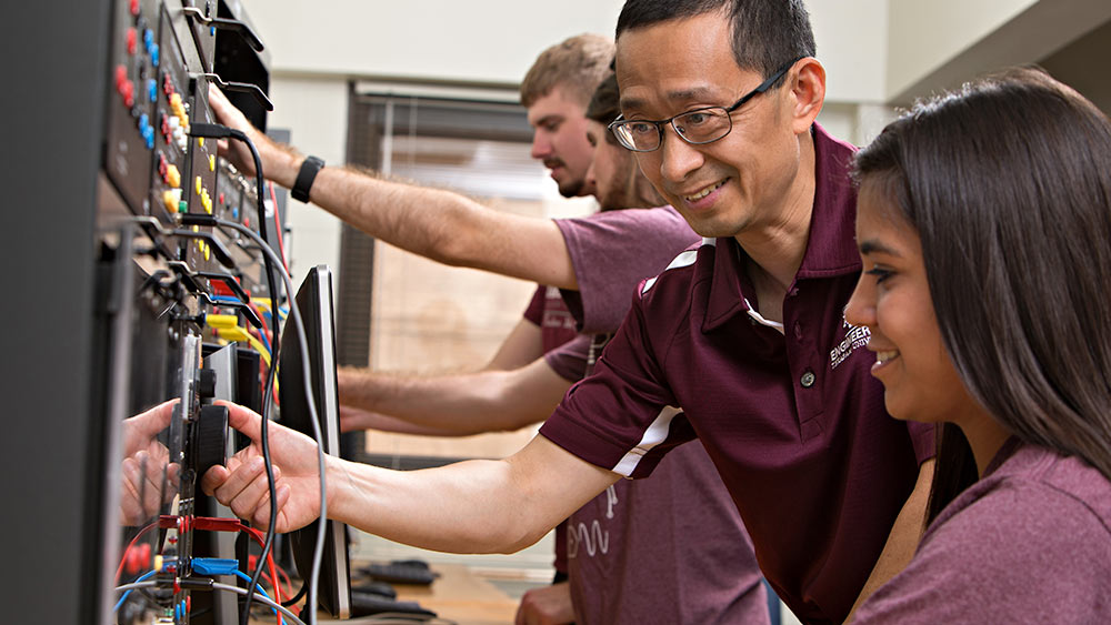 professor with students in classroom