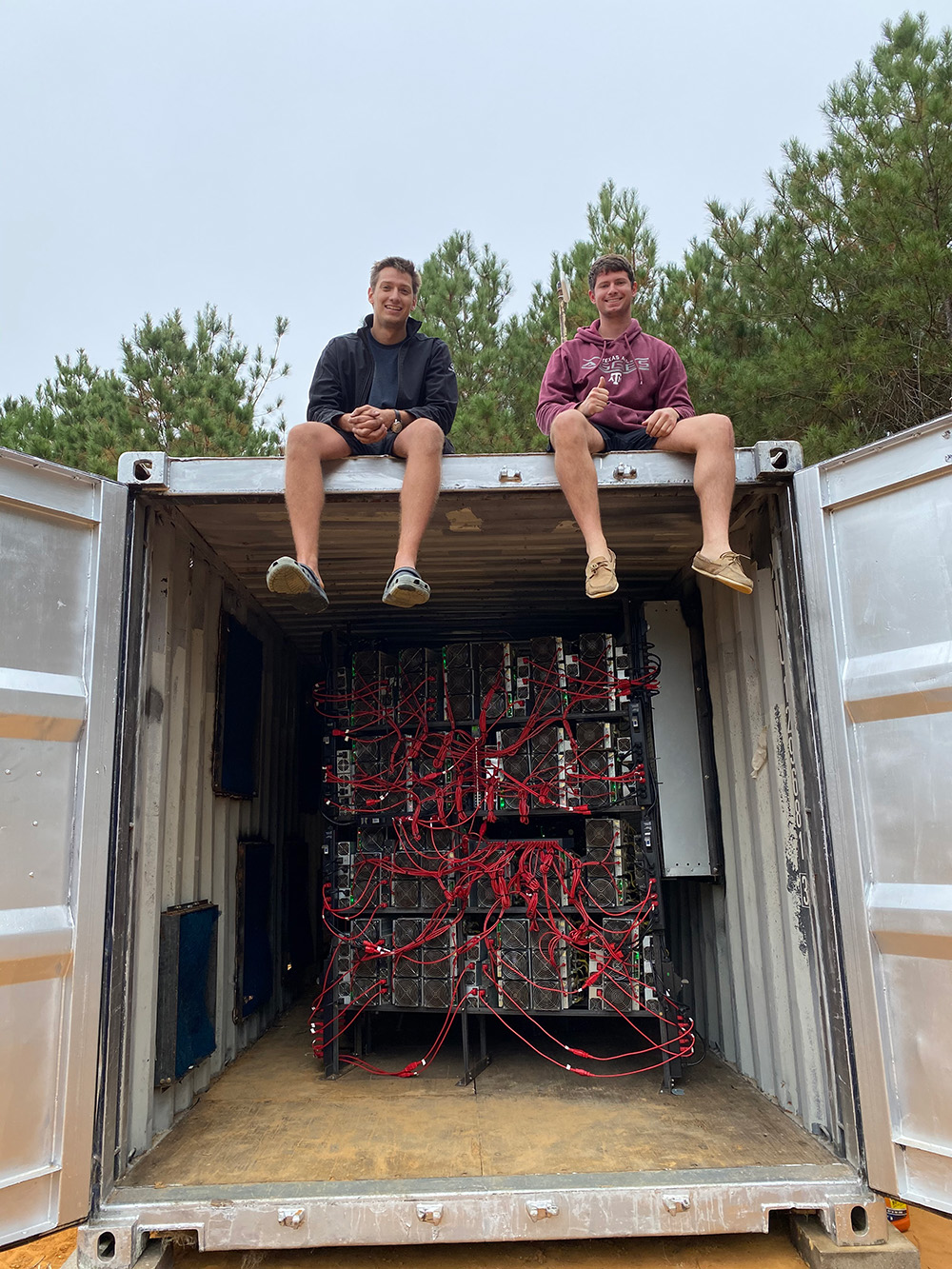 Matt Lostroh and Brent Whitehead with a Bitcoin mining center