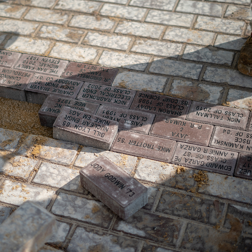 Bricks being installed into Engineering Walk