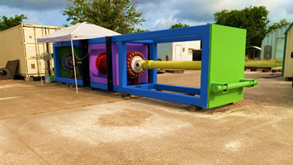 Large brightly colored metal structure sitting under a white canopy