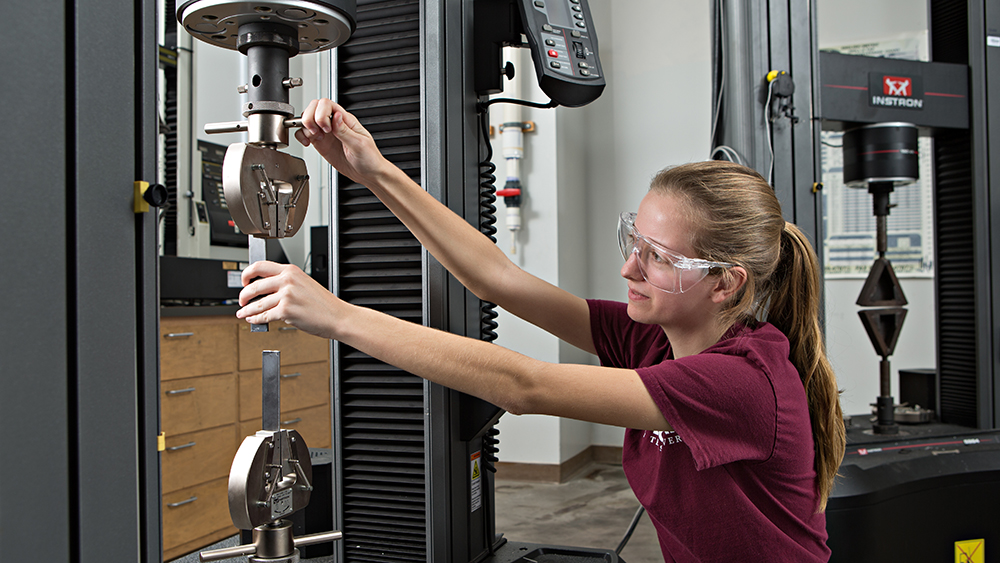 Student performing hands-on research in a lab