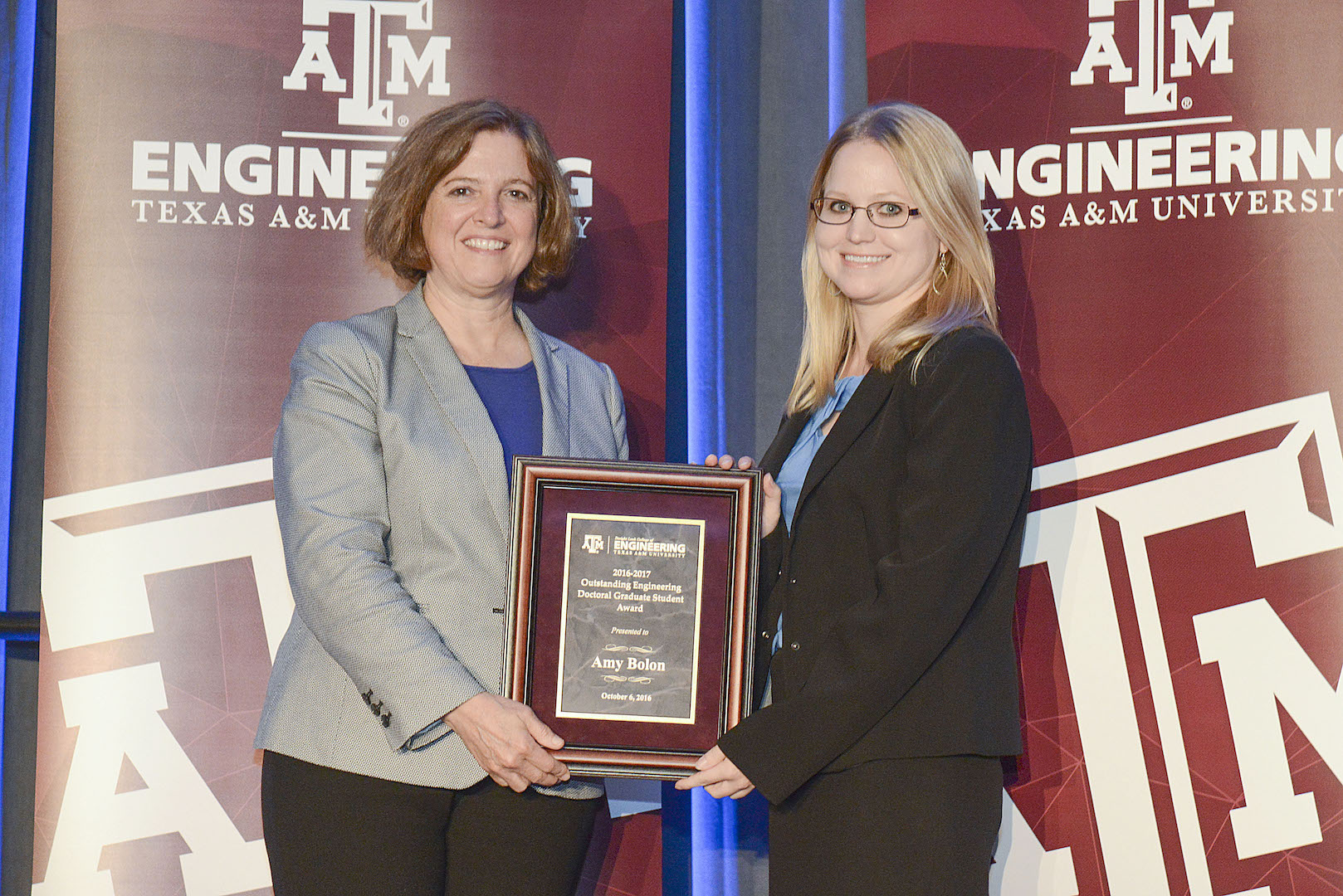 Student receiving award from faculty