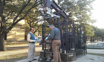 Aggie Well No. 1 with professors Alves and Blasingame