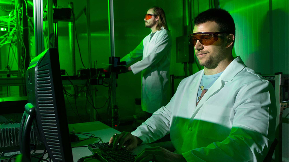 Nolan Goth and another researcher work at the Texas A&M University Thermal Hydraulics Laboratory.