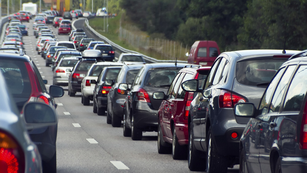 A row of cars down a congested highway.