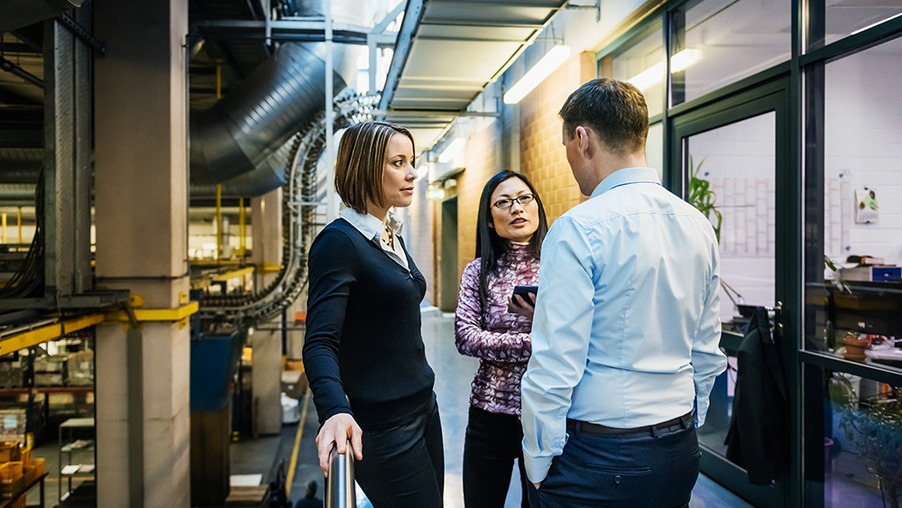 Engineers and industry members discuss a project