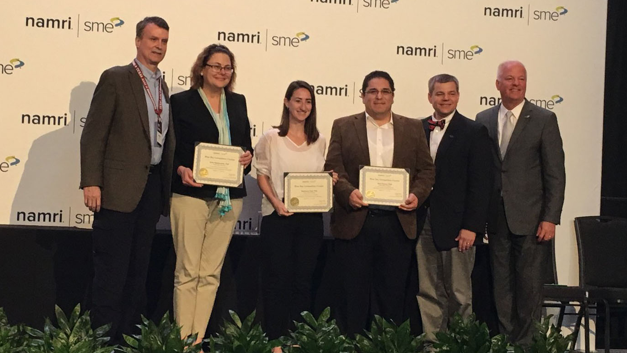 The Texas A&M University team with their certificates of first place during the Blue Sky competition.