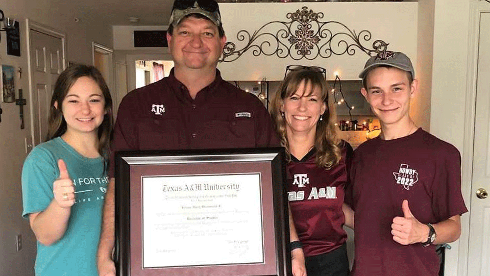 Johnny Waclawcyzk and family with new diploma