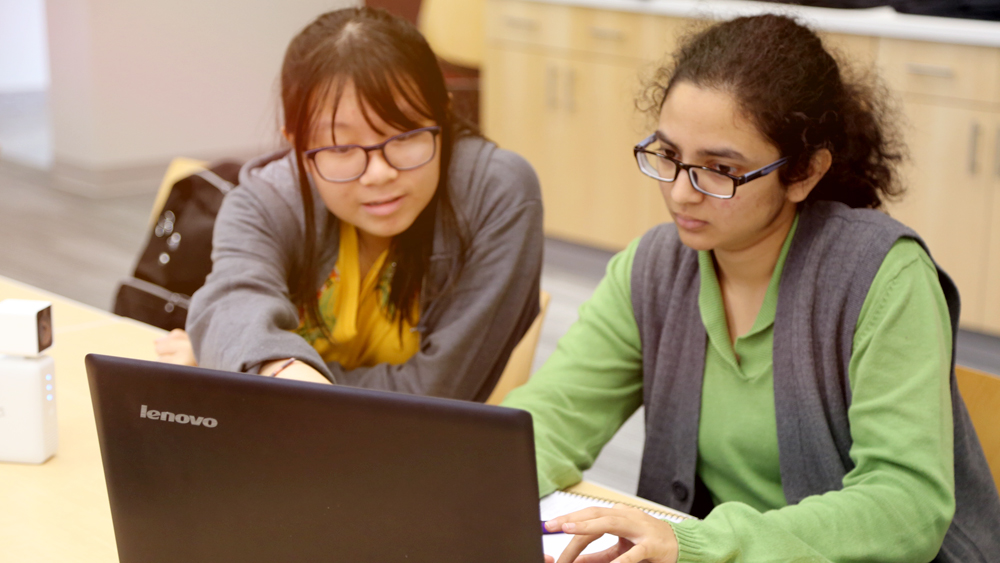 Two students at hackathon