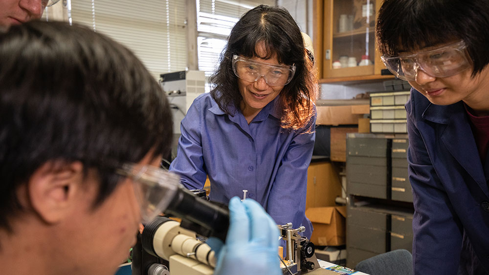 Dr. Liang and students in the laboratory