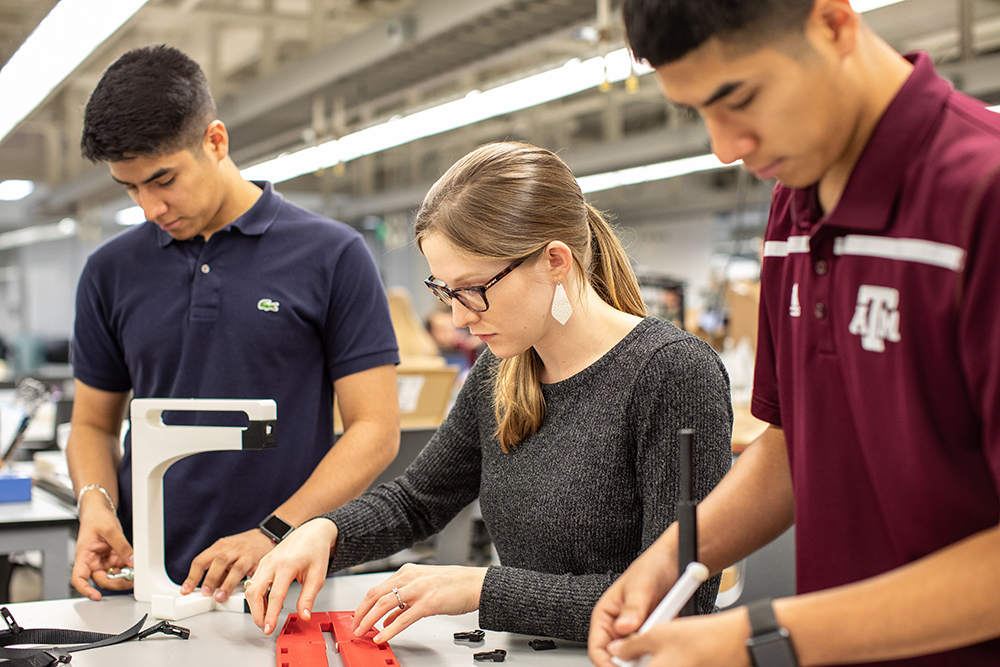 Senior mechanical students work in the Fischer Engineering Design Center.