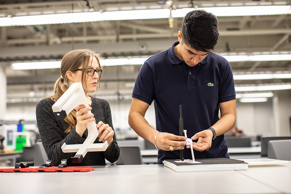 Senior mechanical students work in the Fischer Engineering Design Center.