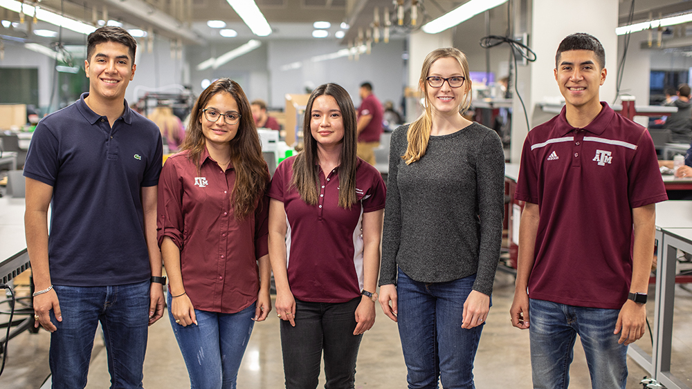 Senior mechanical students work in the Fischer Engineering Design Center.