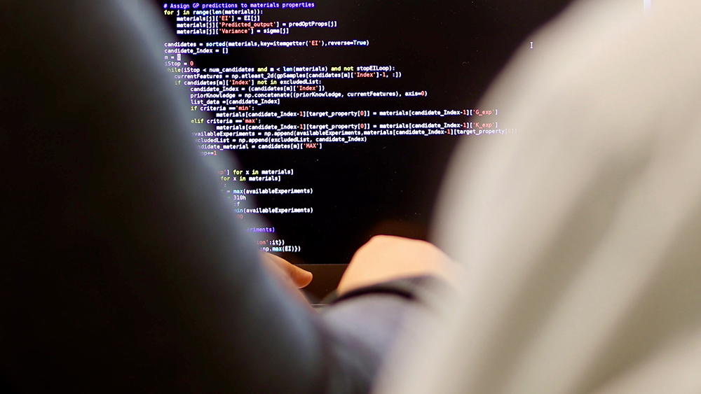 Texas A&amp;M researchers work on a computer.