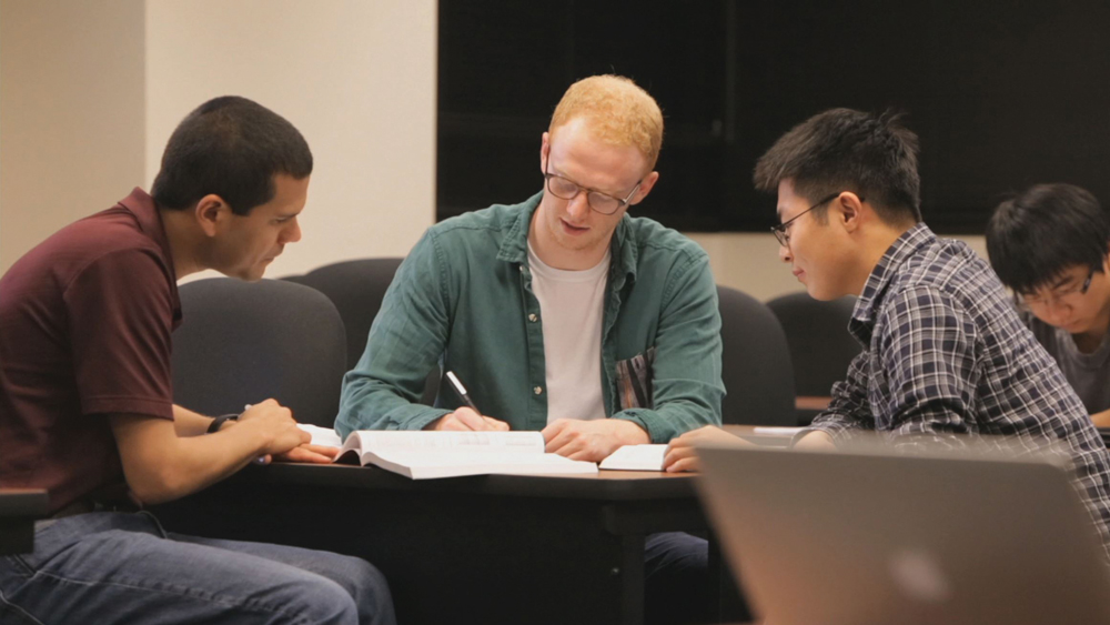 Students studying at a table