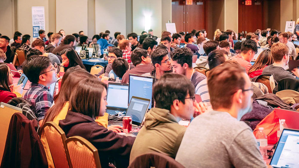 Image of students participating in TAMUhack.