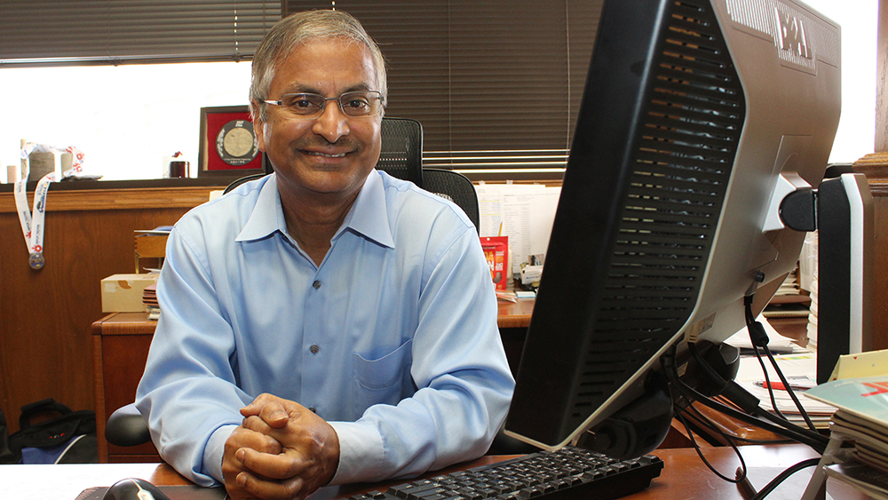 Dr. Akhil Datta-Gupta at desk