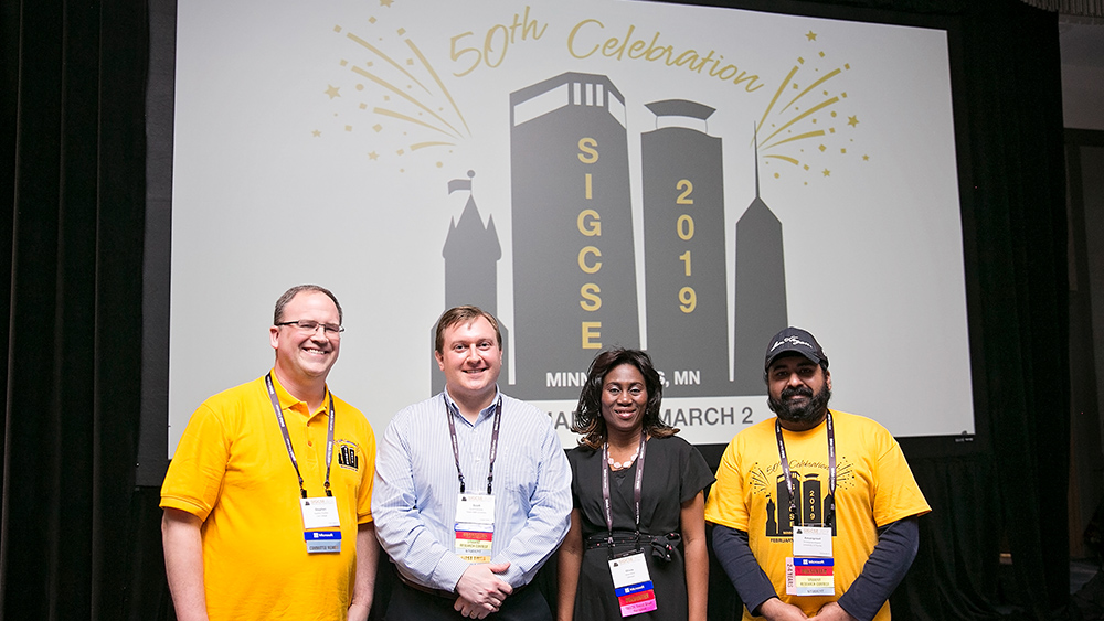 Scott Kolodziej stands with 2019 SIGCSE committee members.