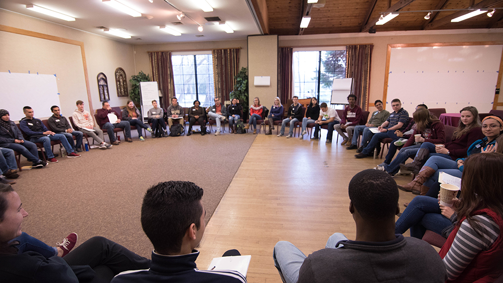 A room with many chairs in a circle