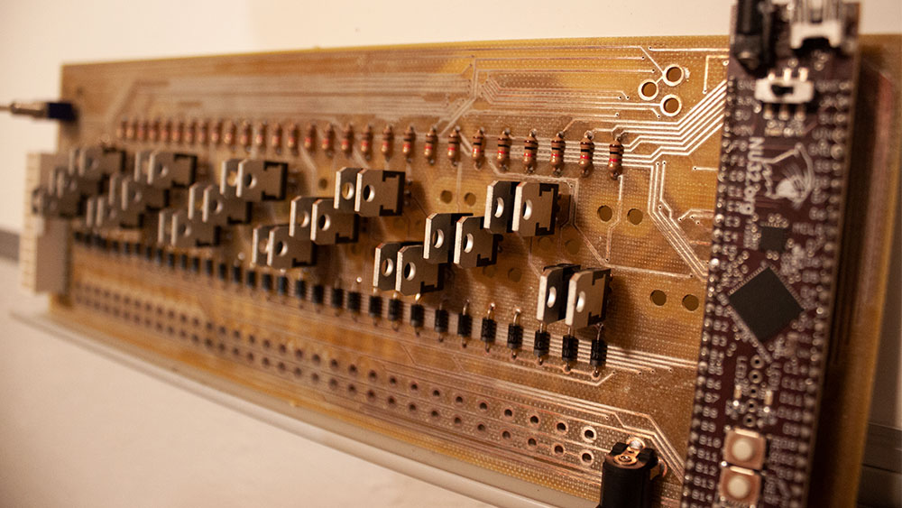 Image of a circuit board and microcontroller.