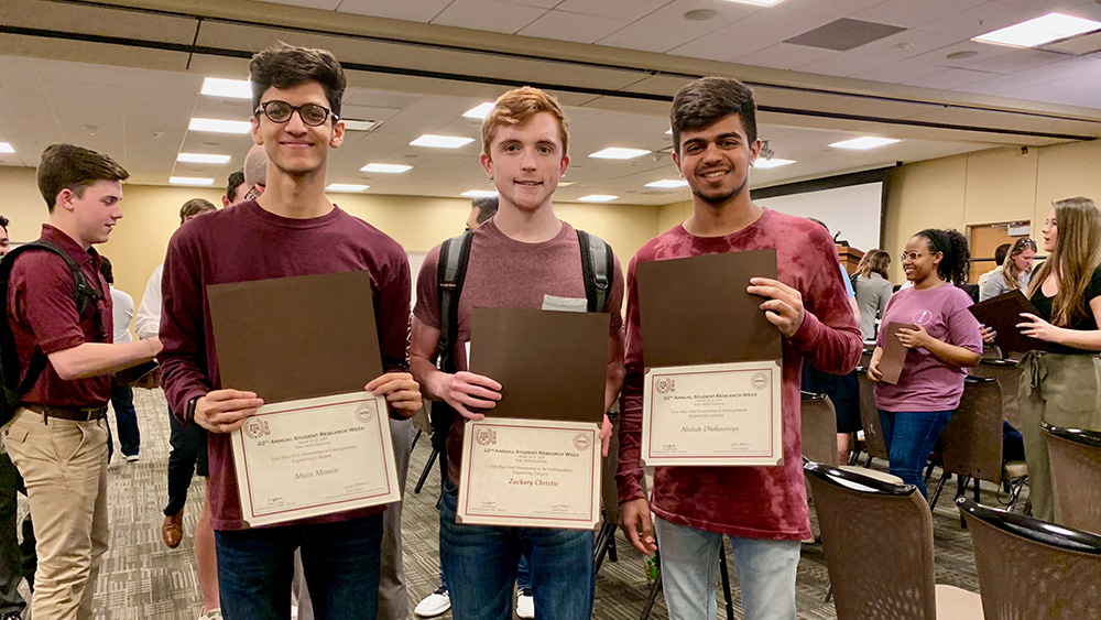 Team members pose after being recognized at the Student Research Week awards ceremony.