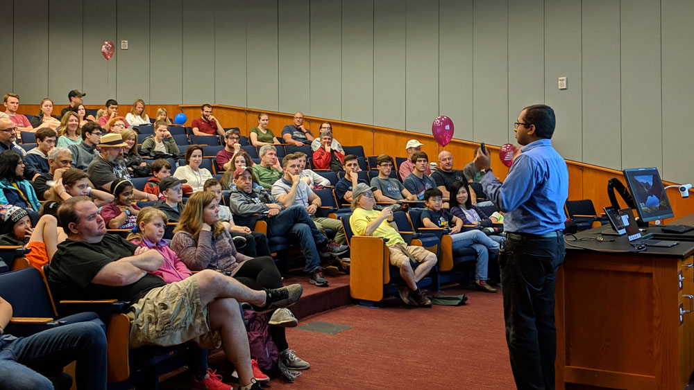 Dr. Kalathil addressing the crowd at his artificial intelligence presentation