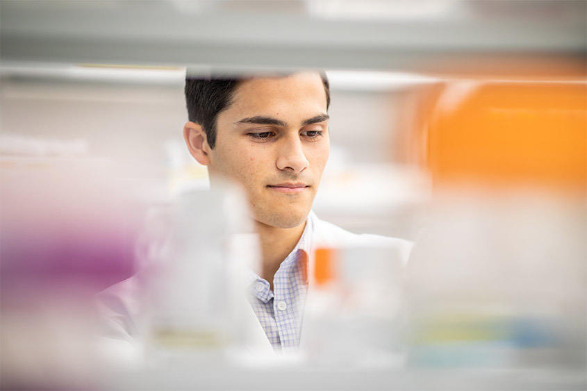 Nathan Bliss sorts through equipment in the lab