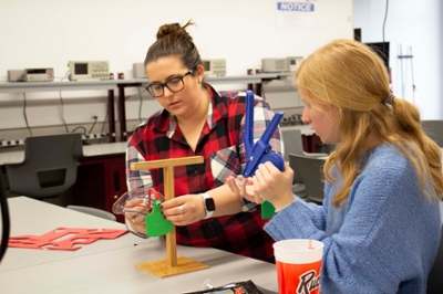 Students work with prototype of cow's ear in design center.