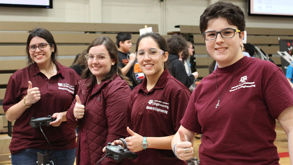 Part of the team is pictured operating their robot.