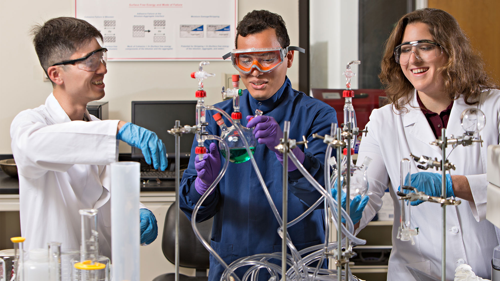 Civil engineering students working in a research lab. 