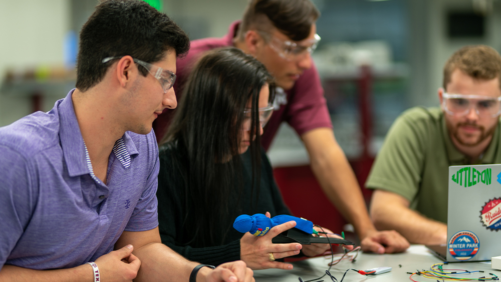 The team working on their seizure alert system prototype. 