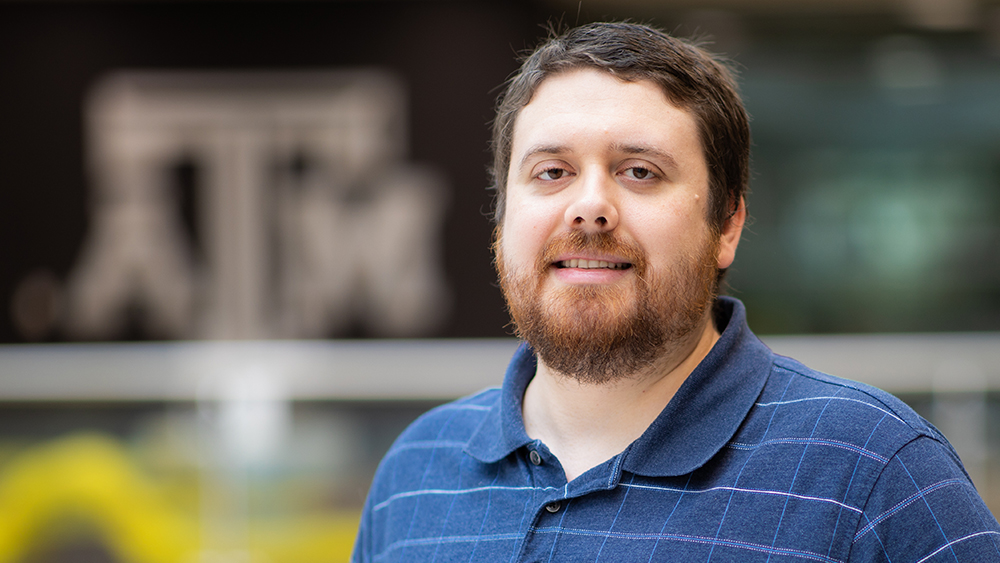 Ph.D. student Marcus Elliott standing in Zachry Engineering Education Complex