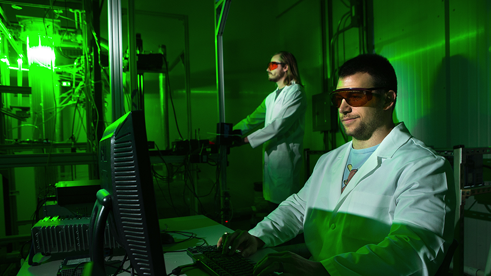 Nuclear engineering students working in a research lab. 