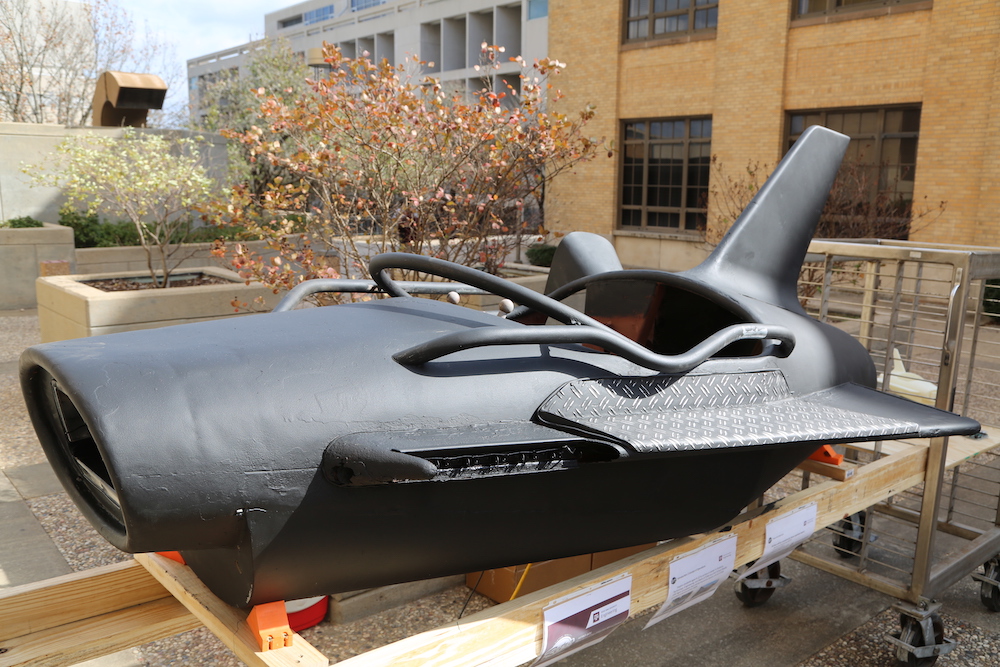 Black metal rocket car from a 1950s carnival ride.