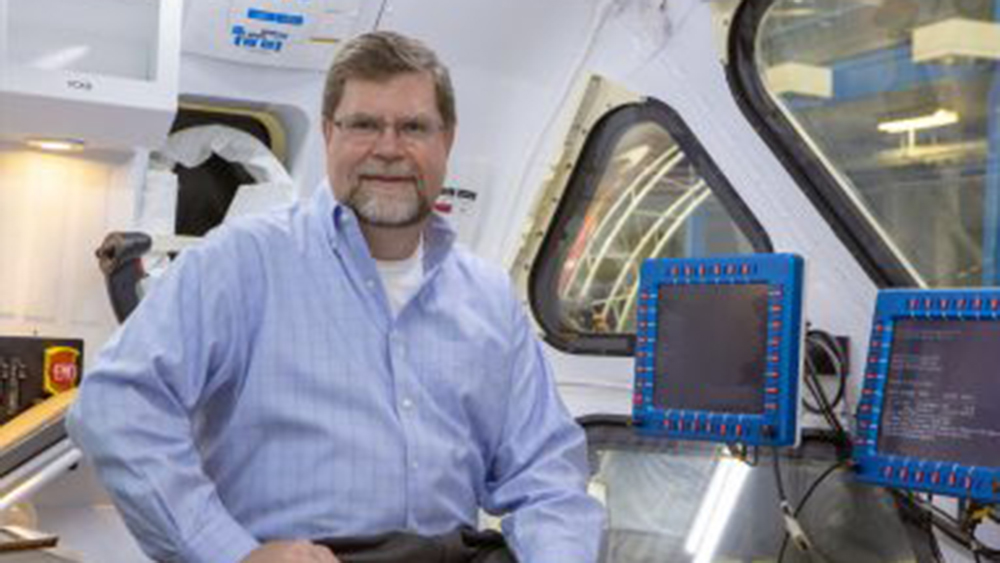 Dr. Robert Ambrose in a space capsule