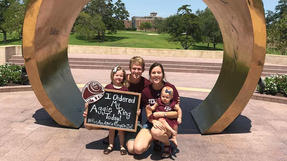 Family photo under a giant ring dome.