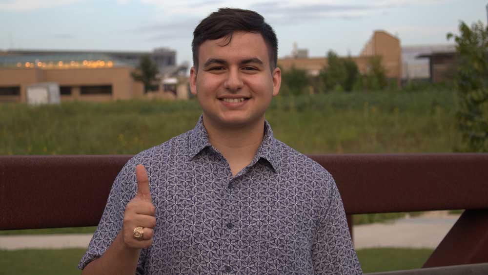 Man posing with a thumbs up