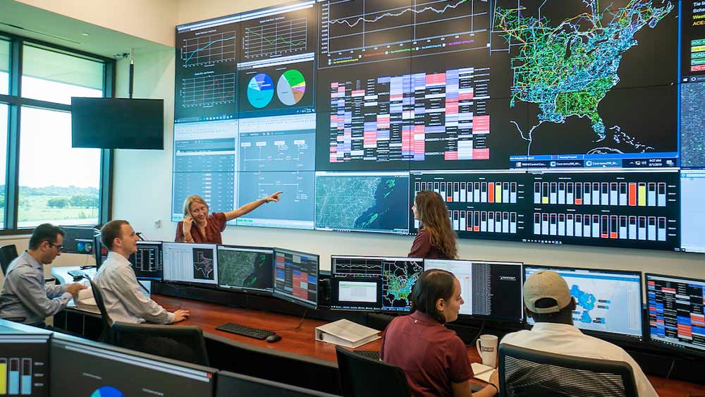 Students sitting at desks in the he Control Room Lab at the Smart Grid Center